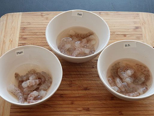 Soaking shrimp in 3 bowls of liquid: plain water, salted water, and water with baking soda. 