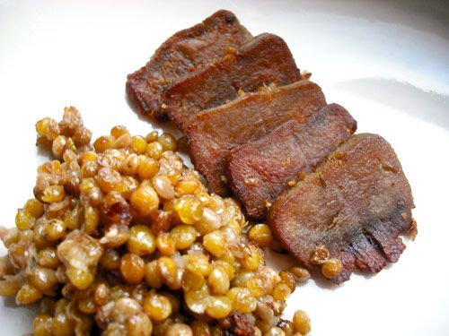 Sliced tongue confit with warm lentil salad.