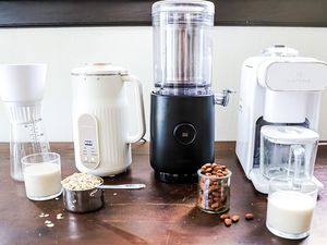four nut milk makers on a wooden countertop