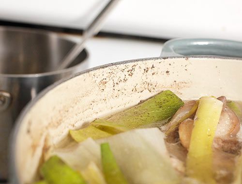 Interior side of stockpot with a thin film of scum.