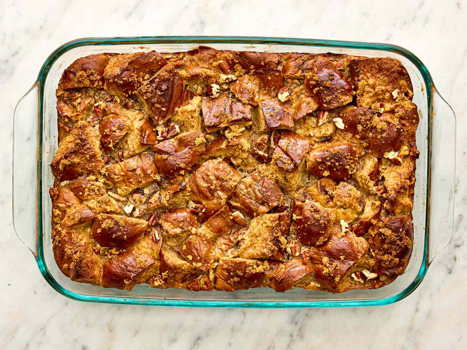 Baking dish holding banana bread pudding with visible baked surface