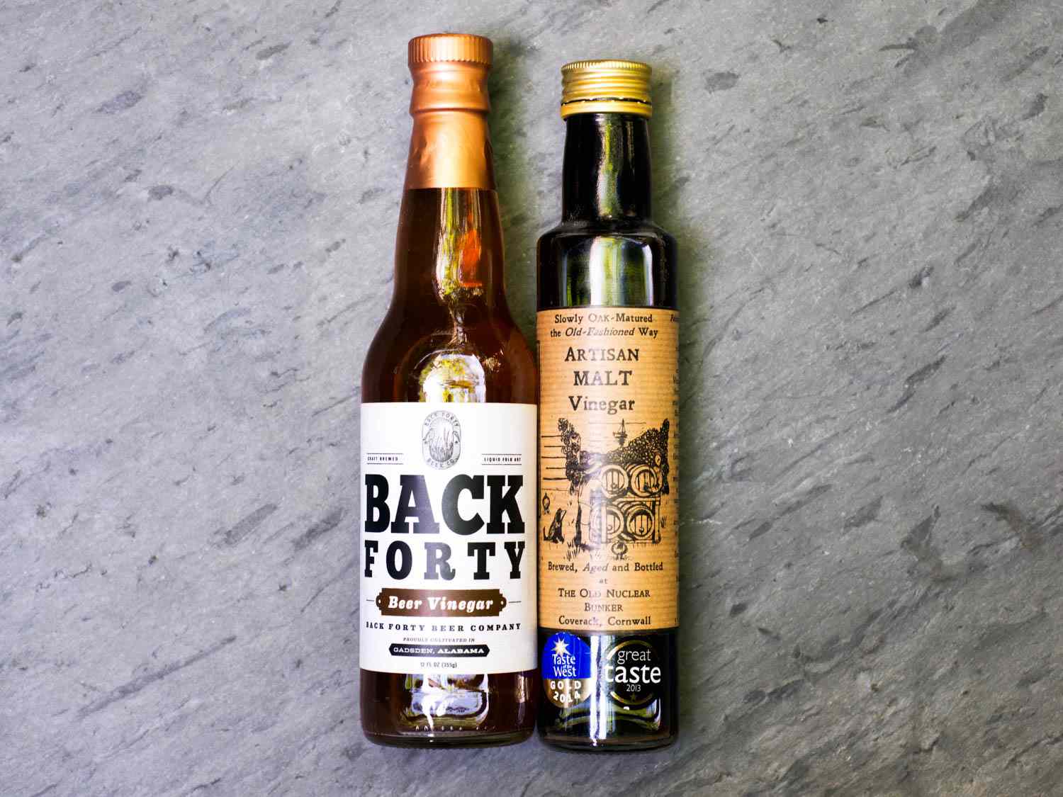 Two bottles of malt vinegar.