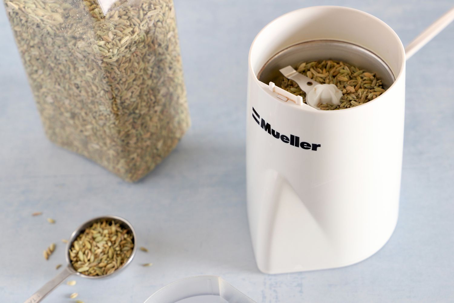 Mueller HyperGrind Precision Electric Spice/Coffee Grinder with fennel seeds inside