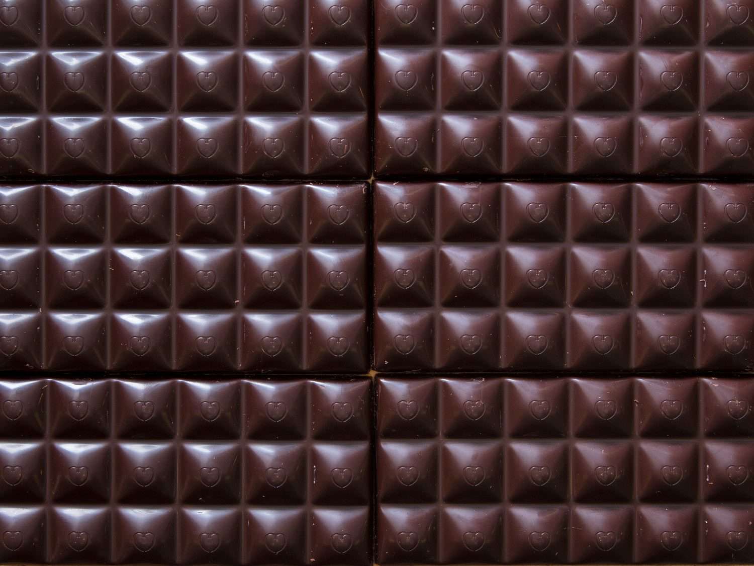 Detail of the grid-like pattern of a chocolate bar.