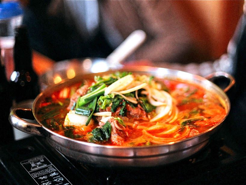 a metal pot full of gamjatang