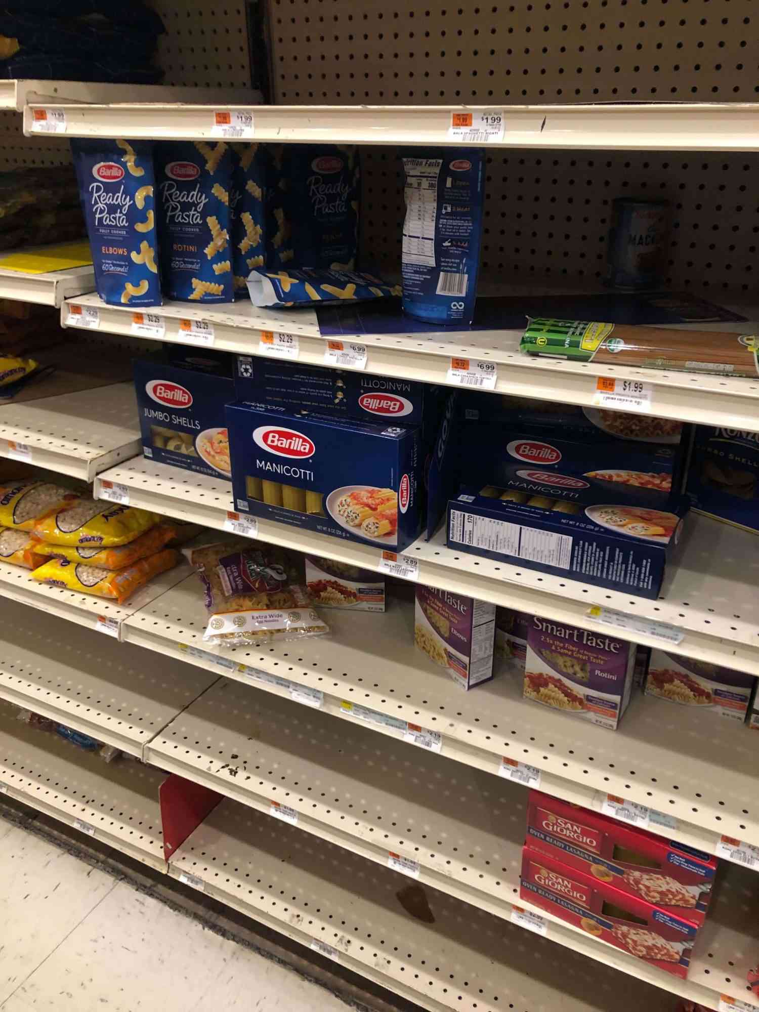Grocery shelves with only manicotti remaining