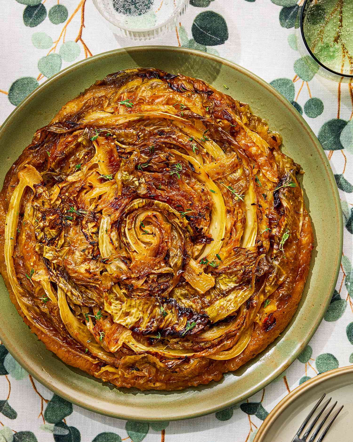 Savory cabbage tart on a green plate