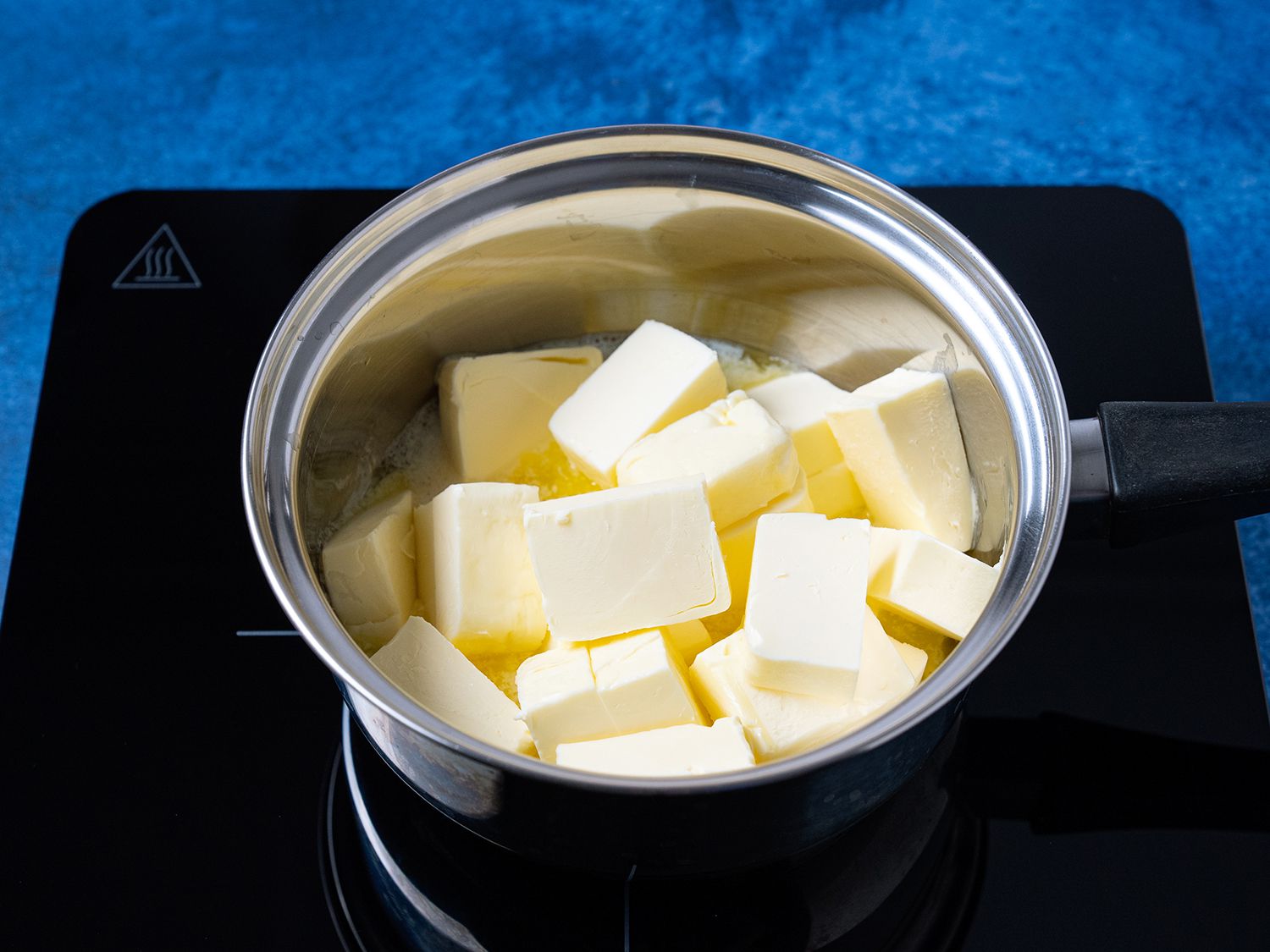 Pieces of butter in a small sauce pan