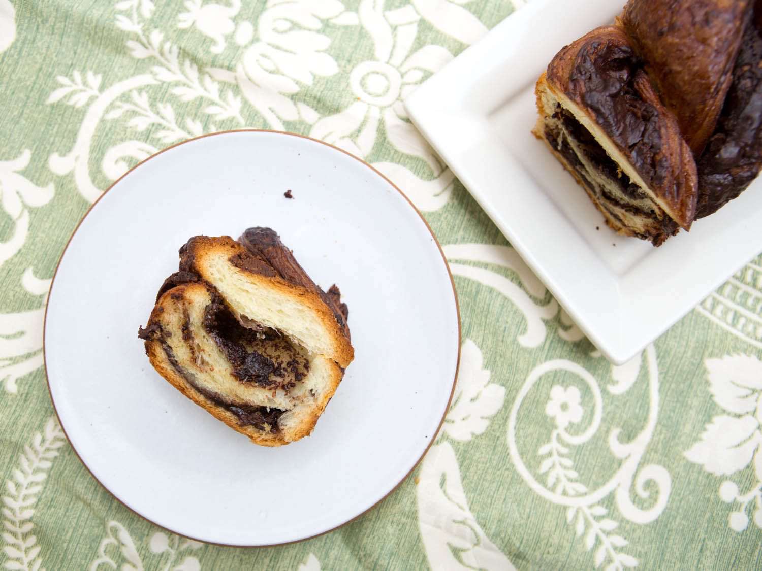 Overhead photo of sliced chocolate babka on serving plate.