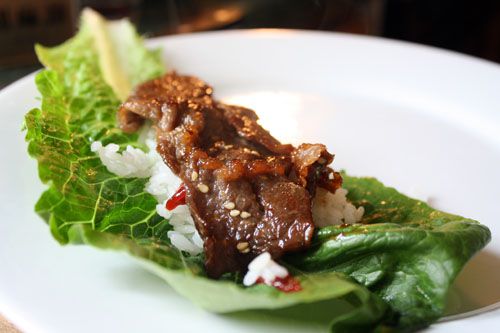 Beef bulgogi on a romaine leaf with some white rice. 