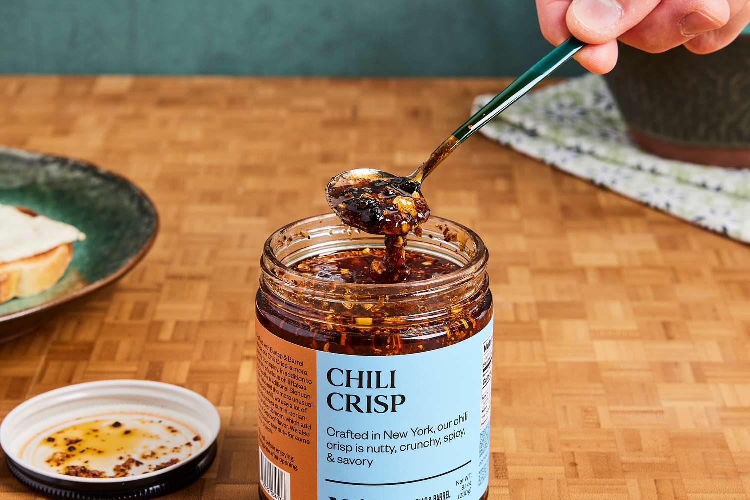 Milu Chili Crisp being scooped