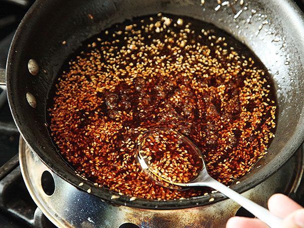 Cooking sauce for sesame chicken in a saucepan. 