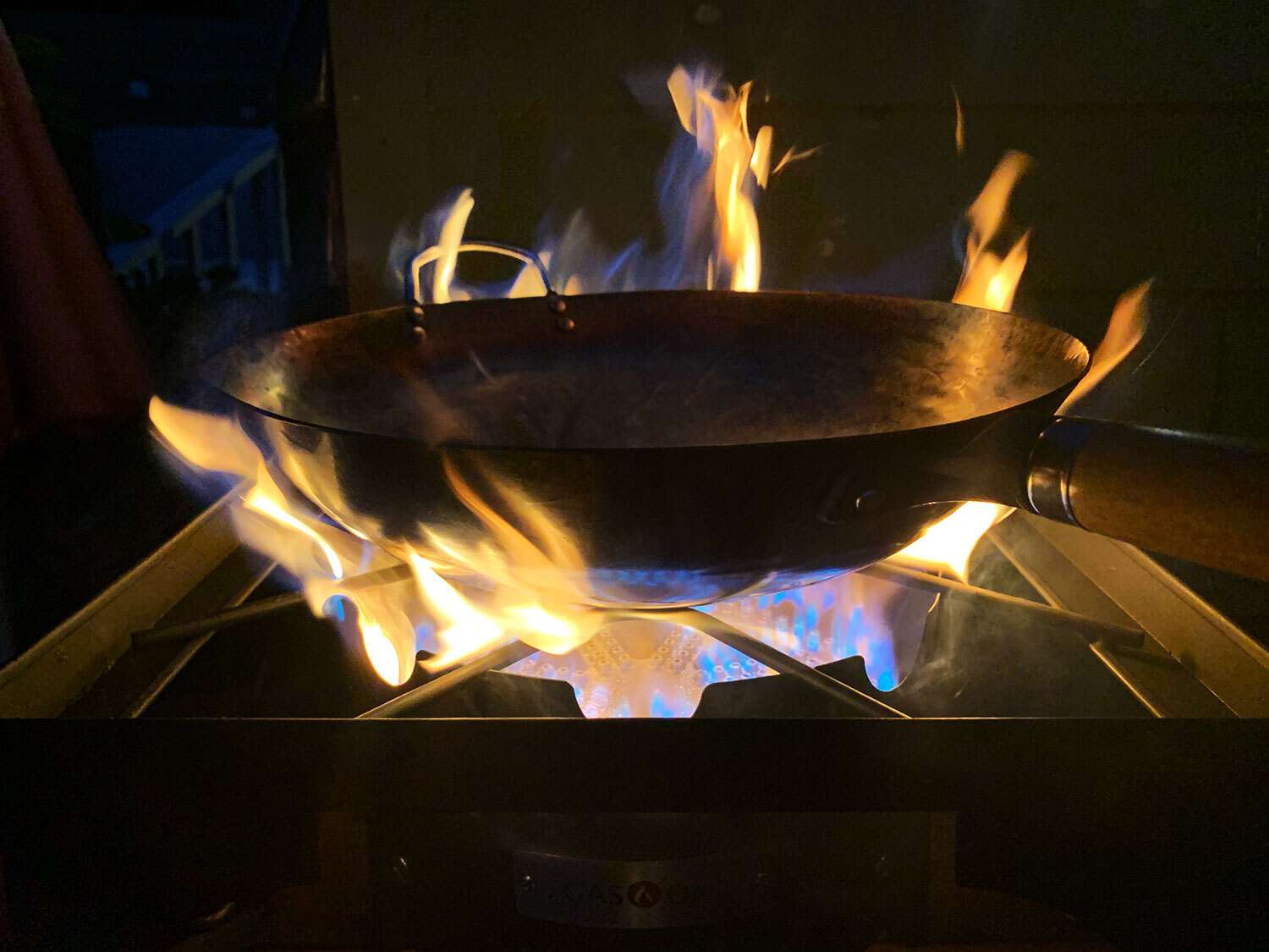 Wok over flames