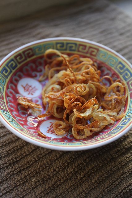 Decorative bowl containing fried shallots.