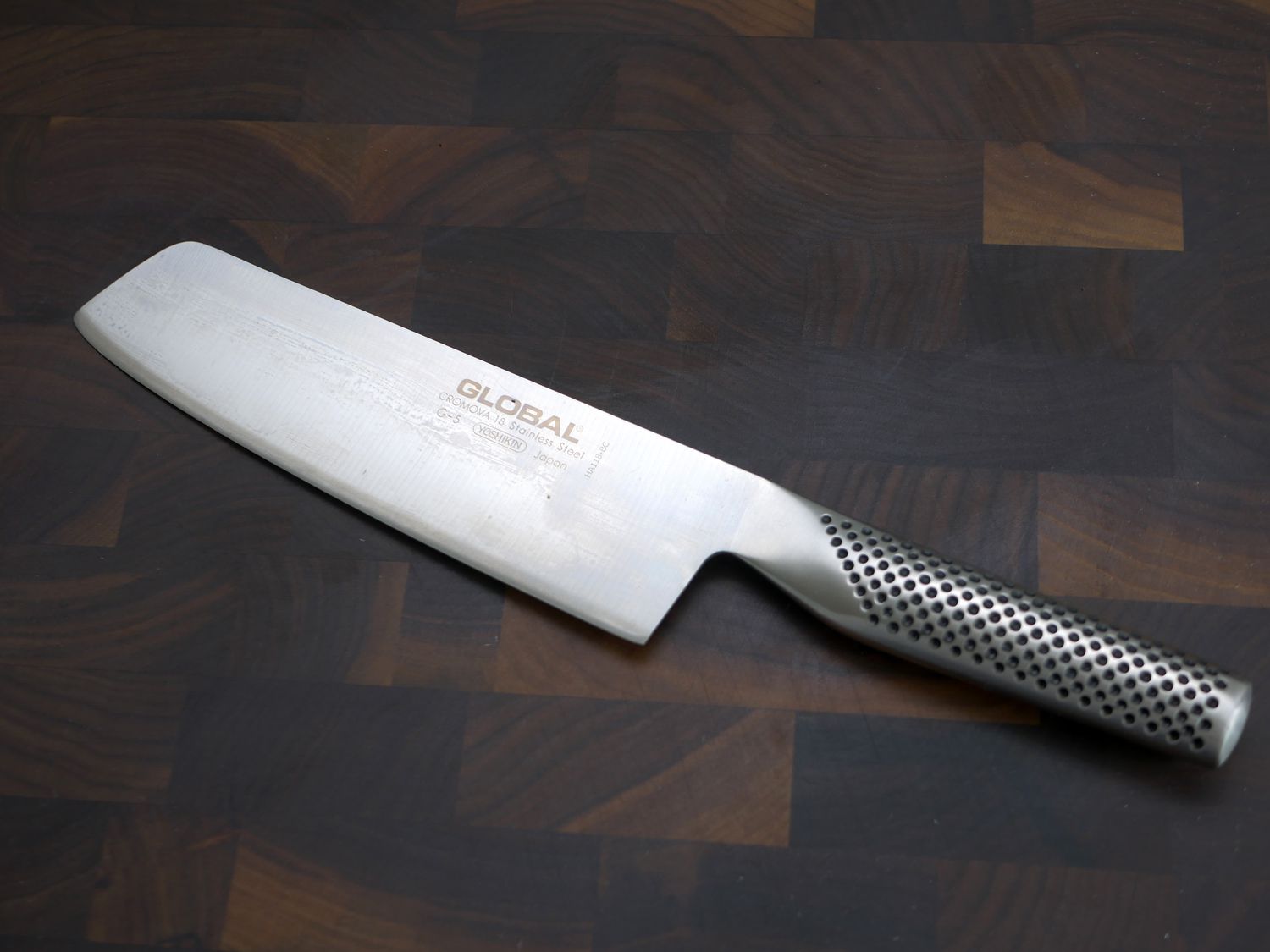 global nakiri on a wooden cutting board