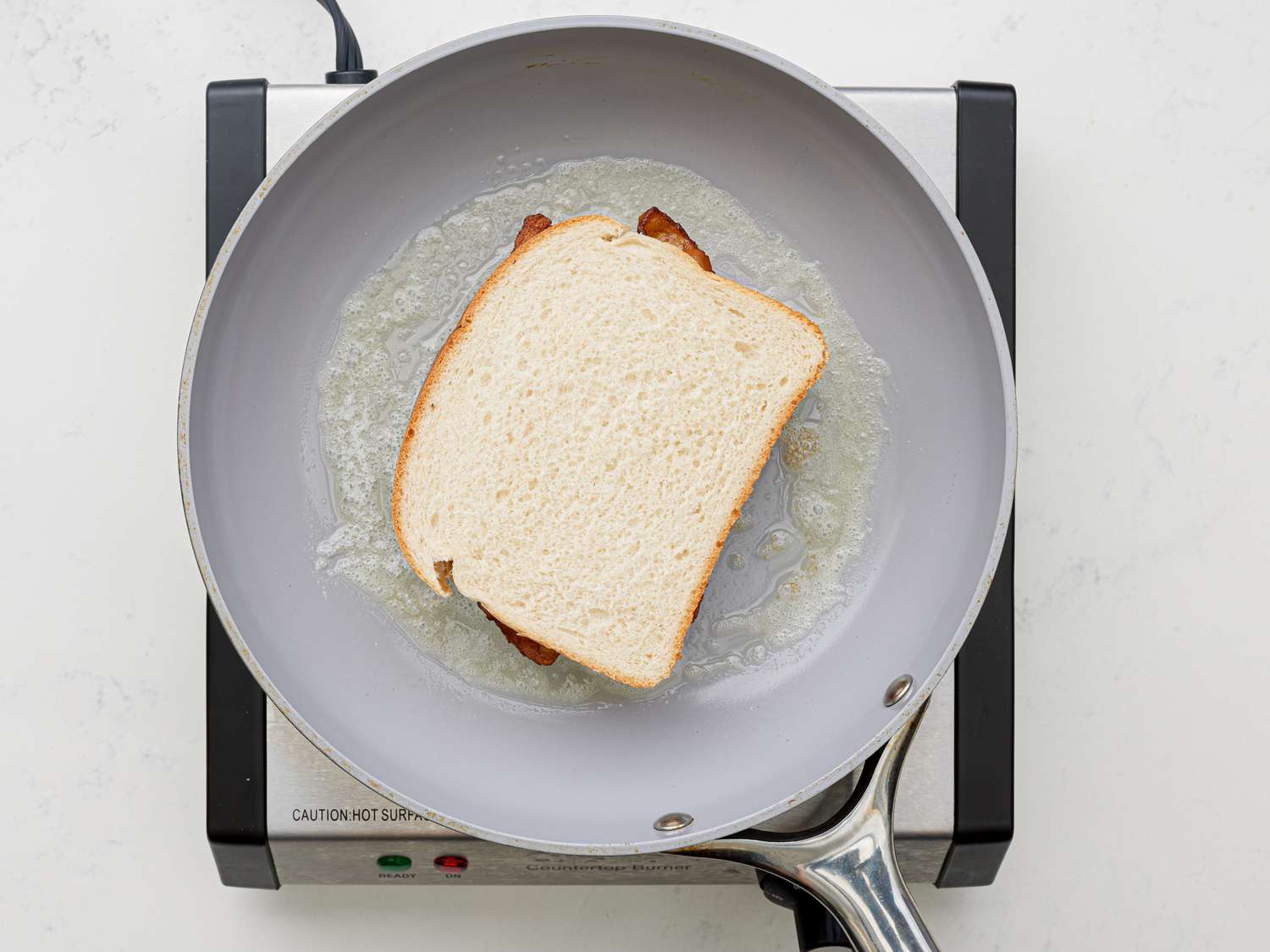 Overhead view of sandwich in skillet