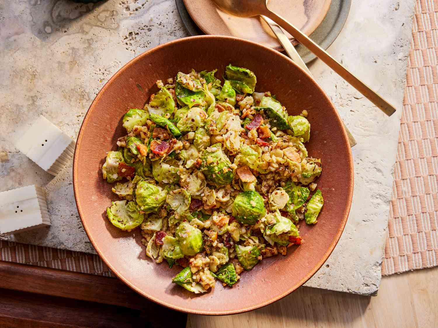 Overhead view of warm brussels sprouts salad on a Thanksgiving 