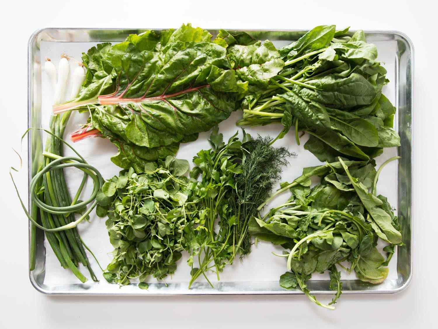 Fresh spinach, watercress, arugula, swiss chard, and herbs