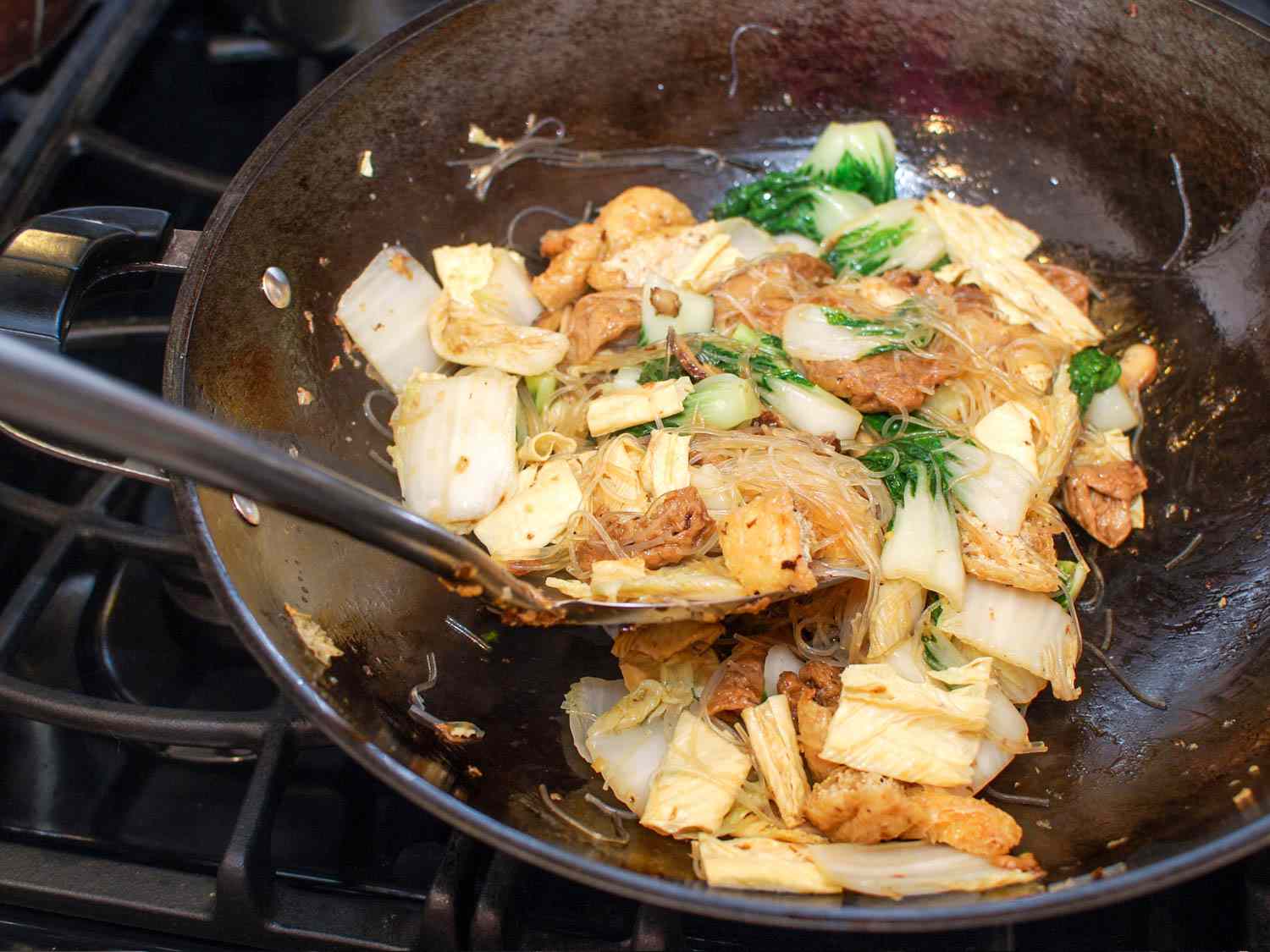 Stirring Buddha's Delight in a wok.
