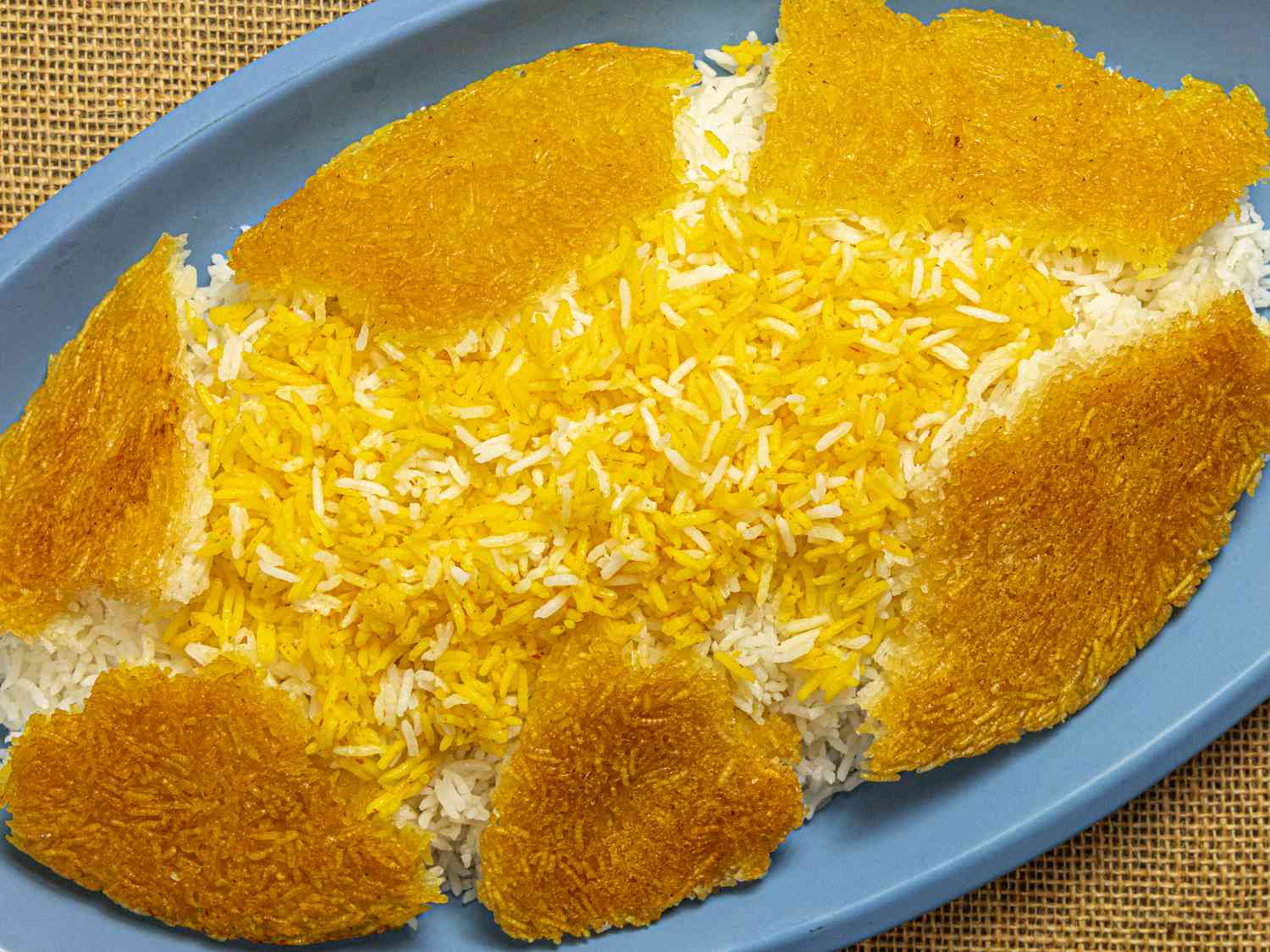 Tahdig ontop of platter of Persian rice