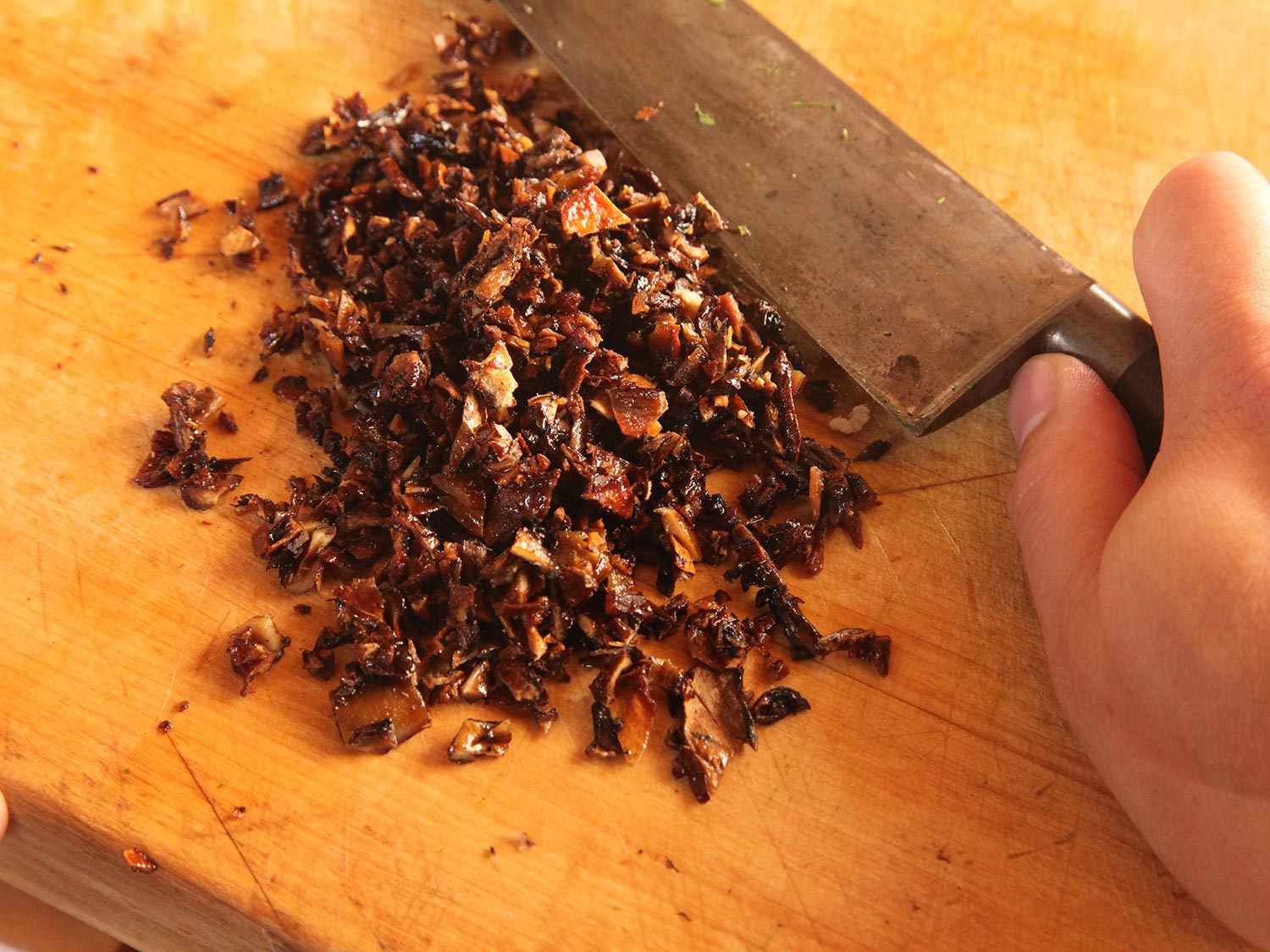 Chopping mushroom bacon.