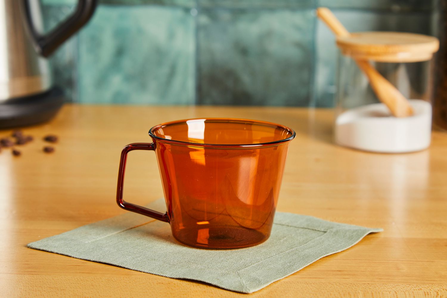 An Amber Kinto mug on a kitchen countertop.