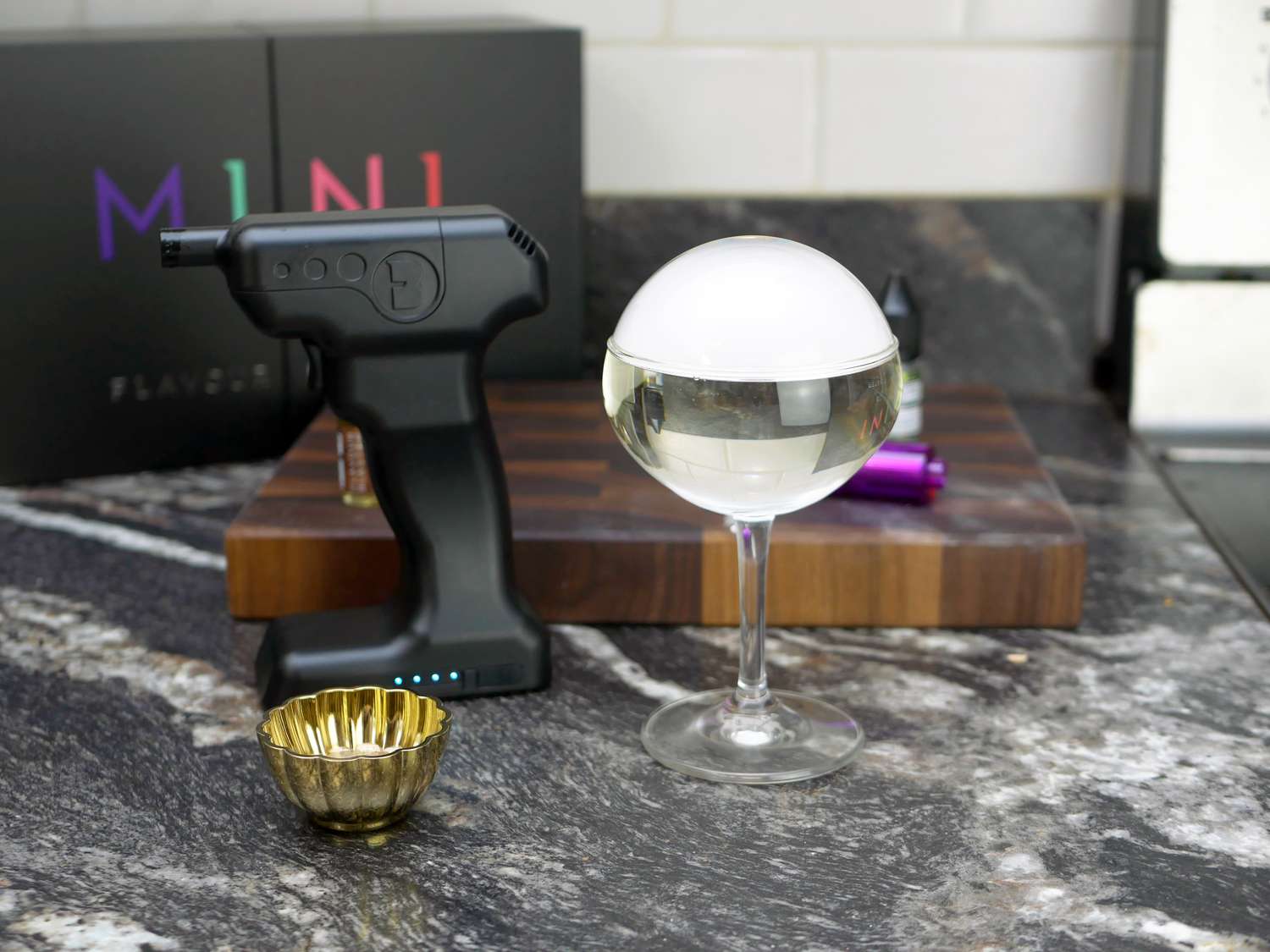 flavour blaster mini with a bubble on a coupe glass drink