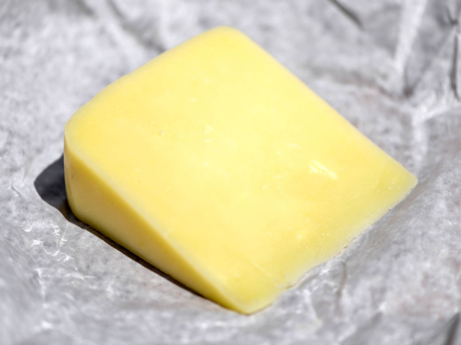 a wedge of kasseri cheese
