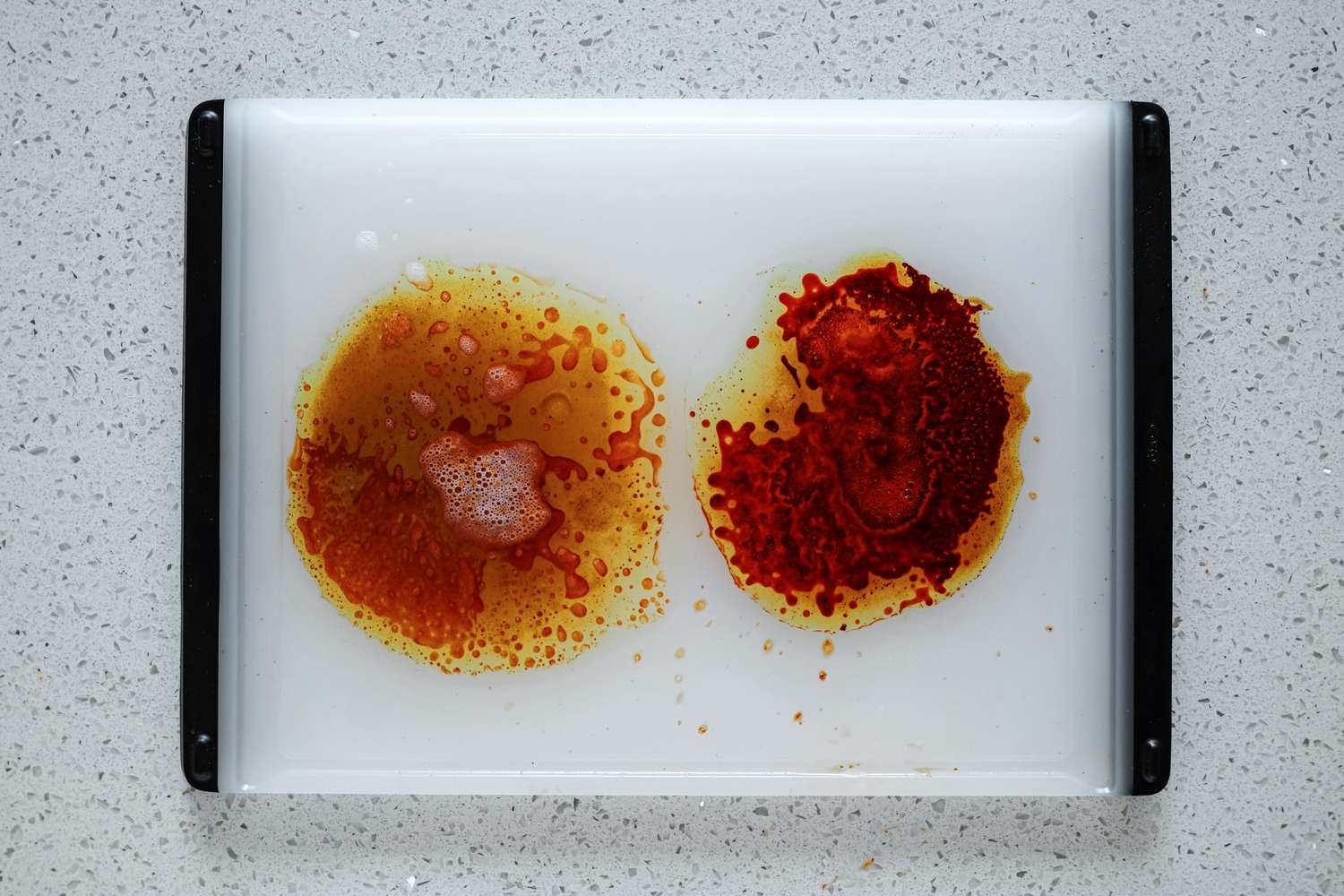 Two food stains surrounded by degreasers