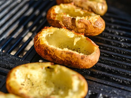 Hollowed out once-baked potatoes getting their second baking.