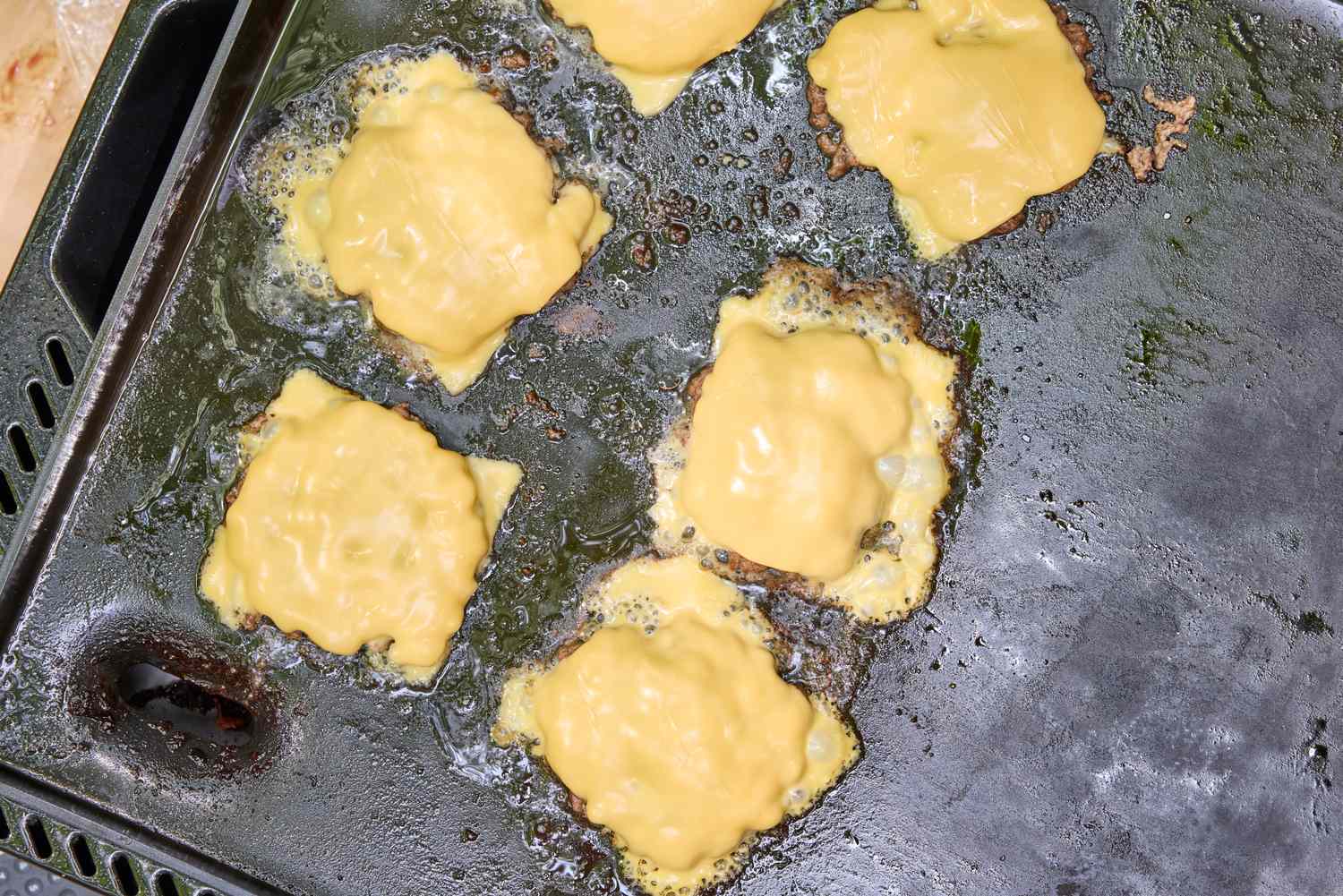 Cheeseburgers made using the Weber Slate 22 inch Rust-Resistant Tabletop Griddle