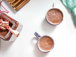 overhead view of two mugs of hot cocoa