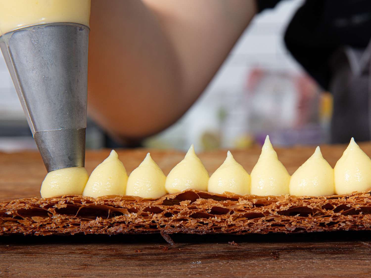 Side view of piping pastry cream