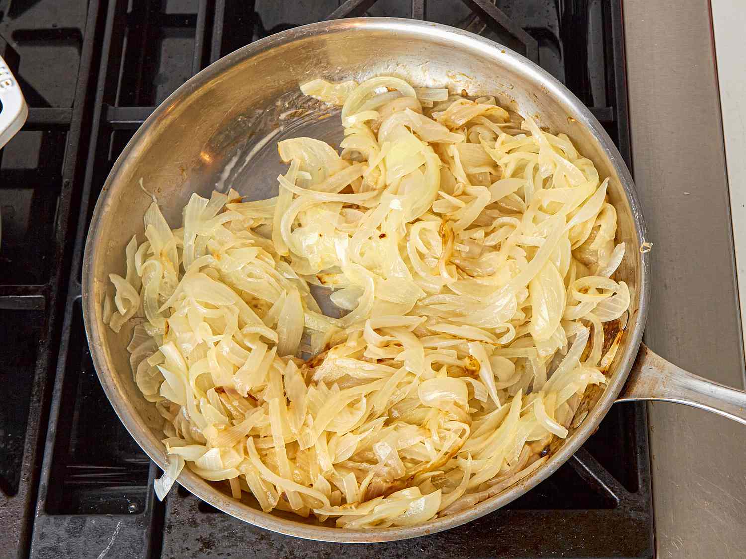 Overhead view of onions cooking
