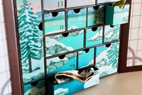 The interior of the Bokksu Advent Calendar with some drawers ajar