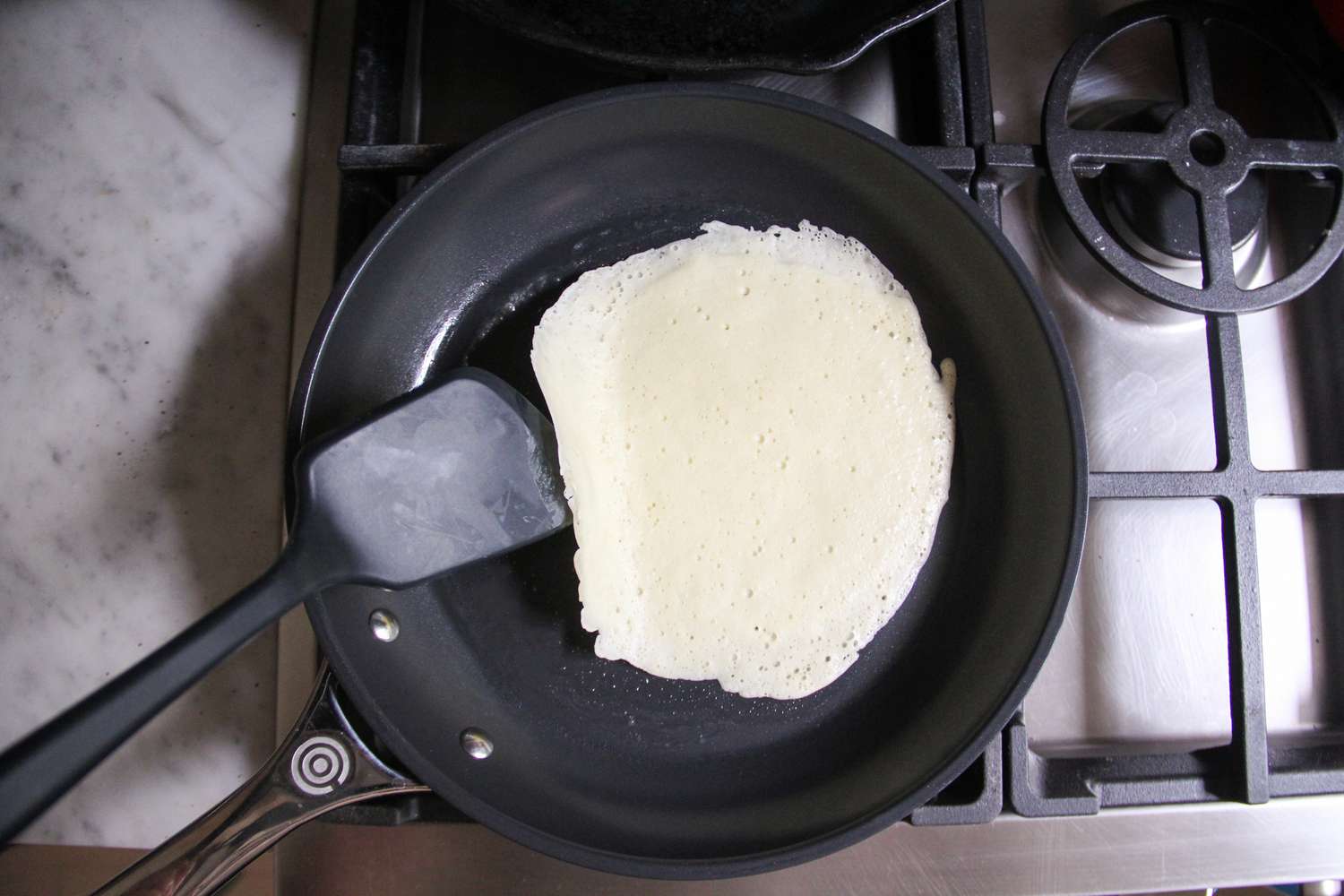 Food cooking in the Le Creuset Ceramic Nonstick Frying Pan