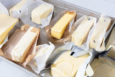 Eleven sticks of unwrapped unsalted butter.