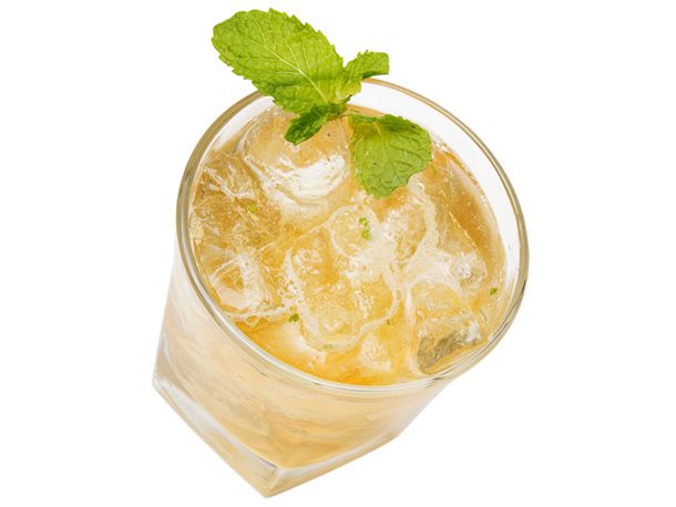 A whiskey smash with a mint leaf garnish. 