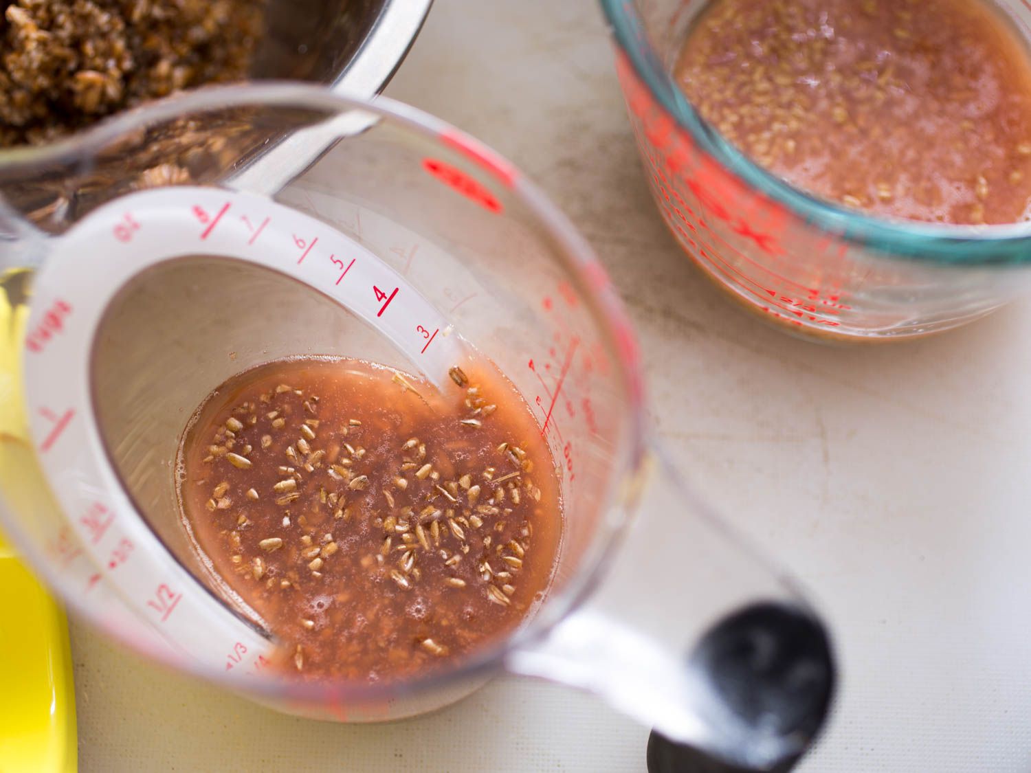 Soaking bulgur in drained tomato water for tabbouleh.