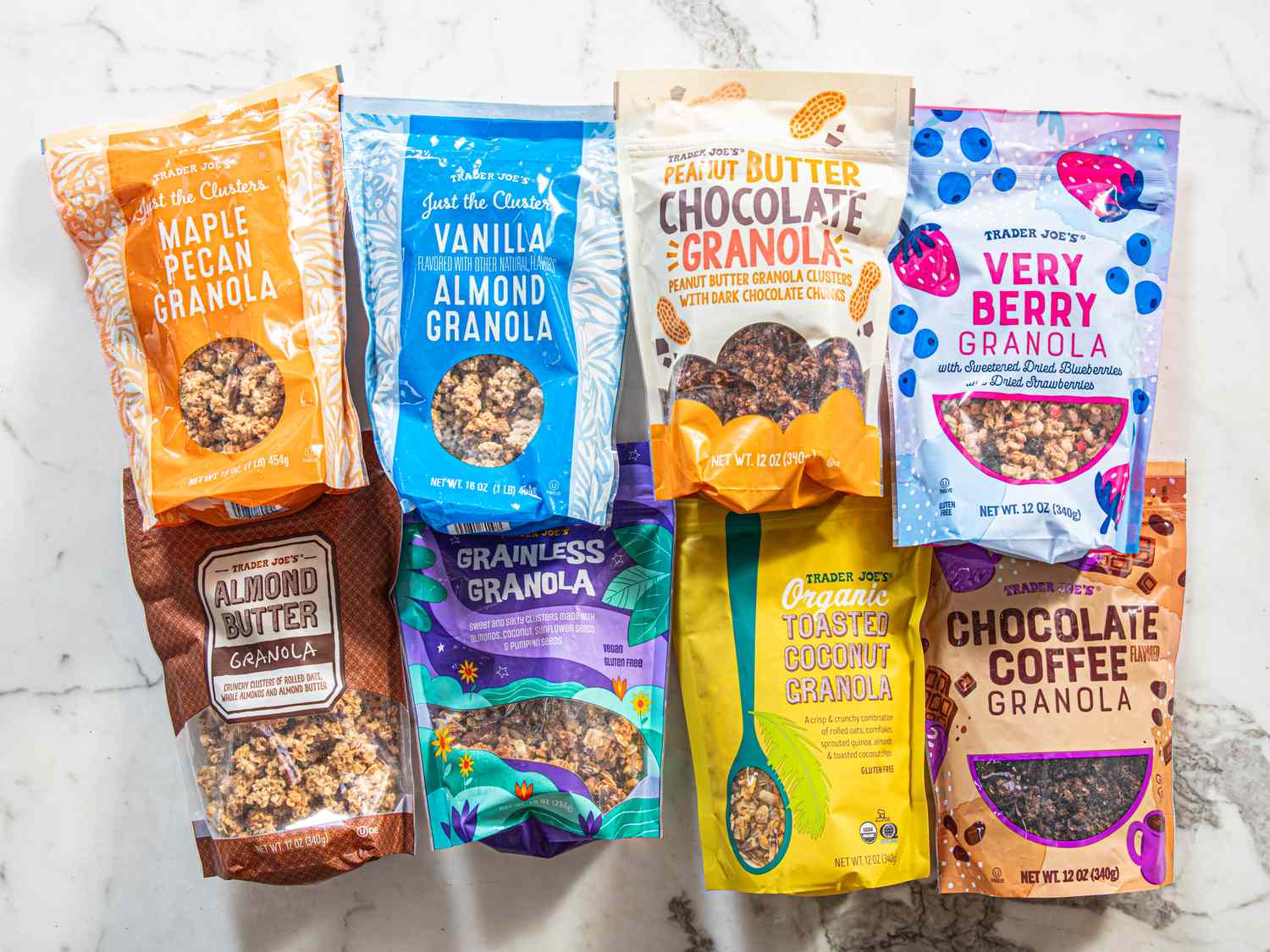 Various Trader Joes granola packages arranged on a marble surface