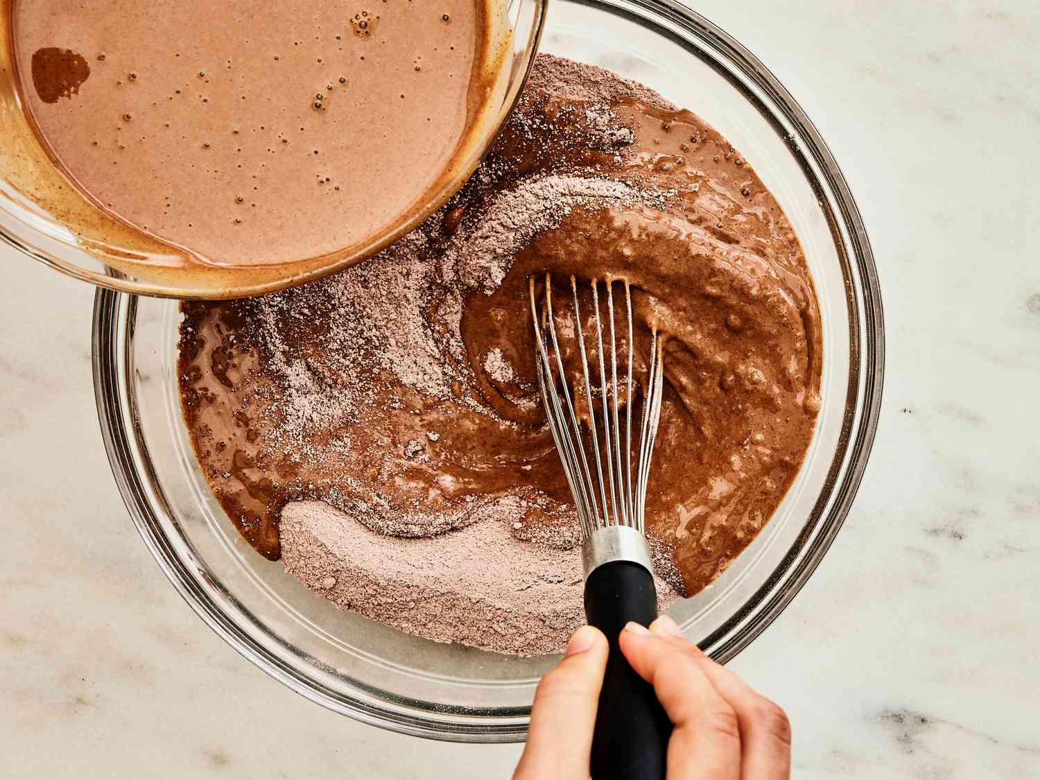 Whisking chocolate mixture into dry ingredients 