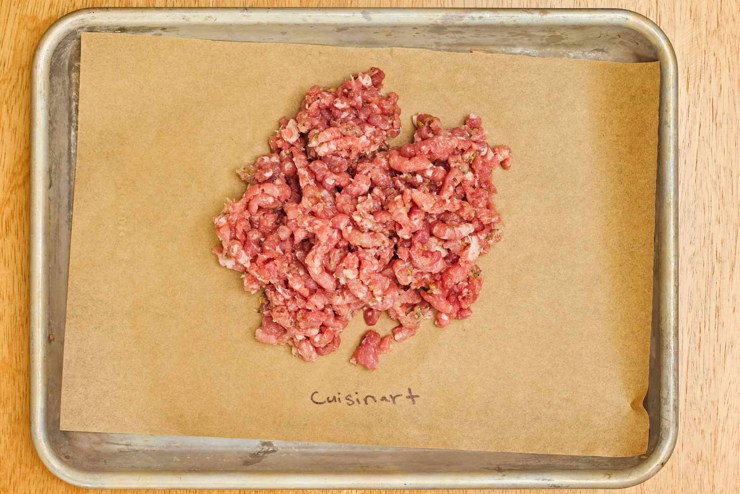 Grind meat from the Cuisinart Electric Meat Grinder displayed in tray