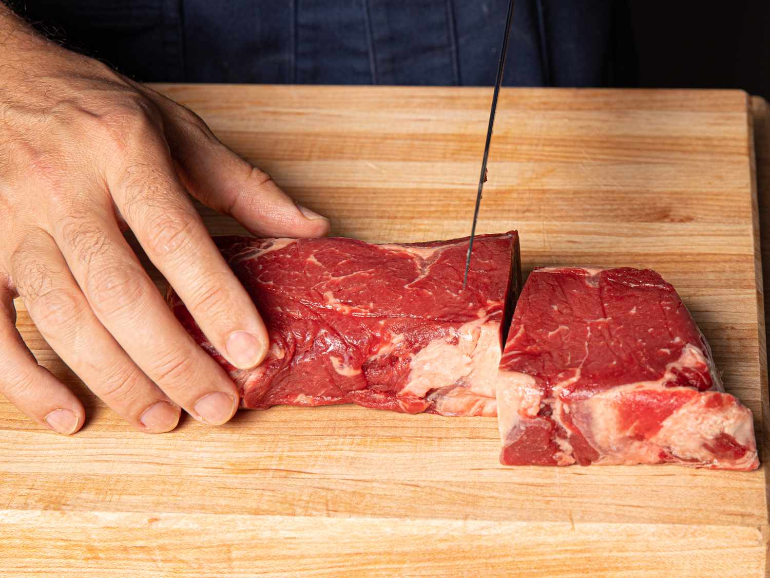 Cutting ribeye into pieces