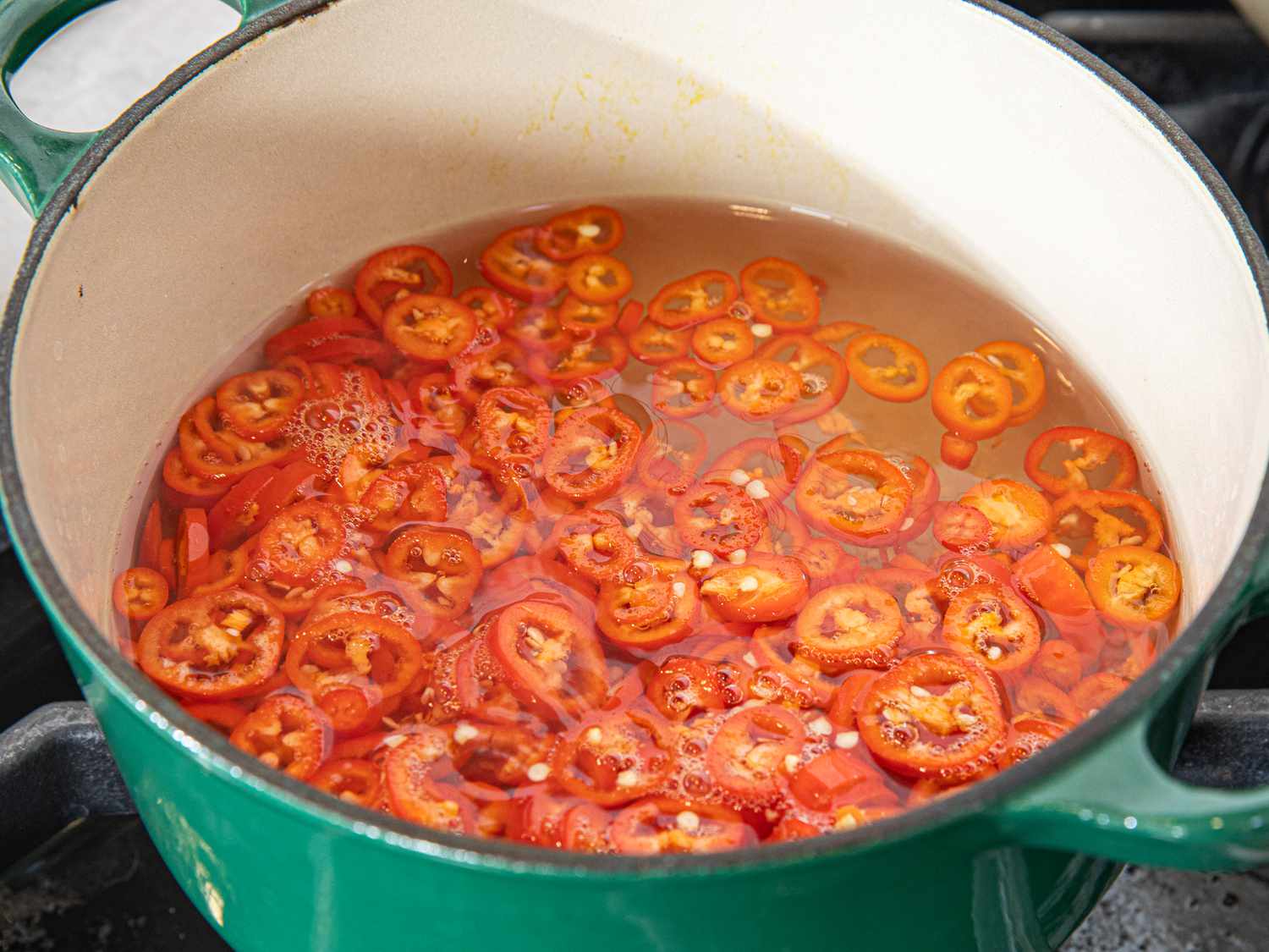 Overhead view of chiles in vingear