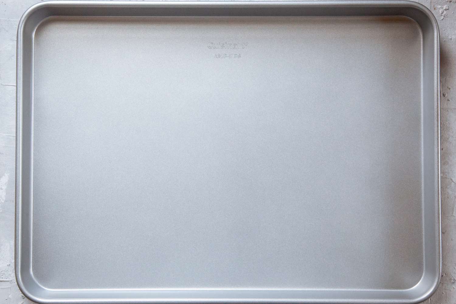 A nonstick sheet pan on a kitchen countertop.