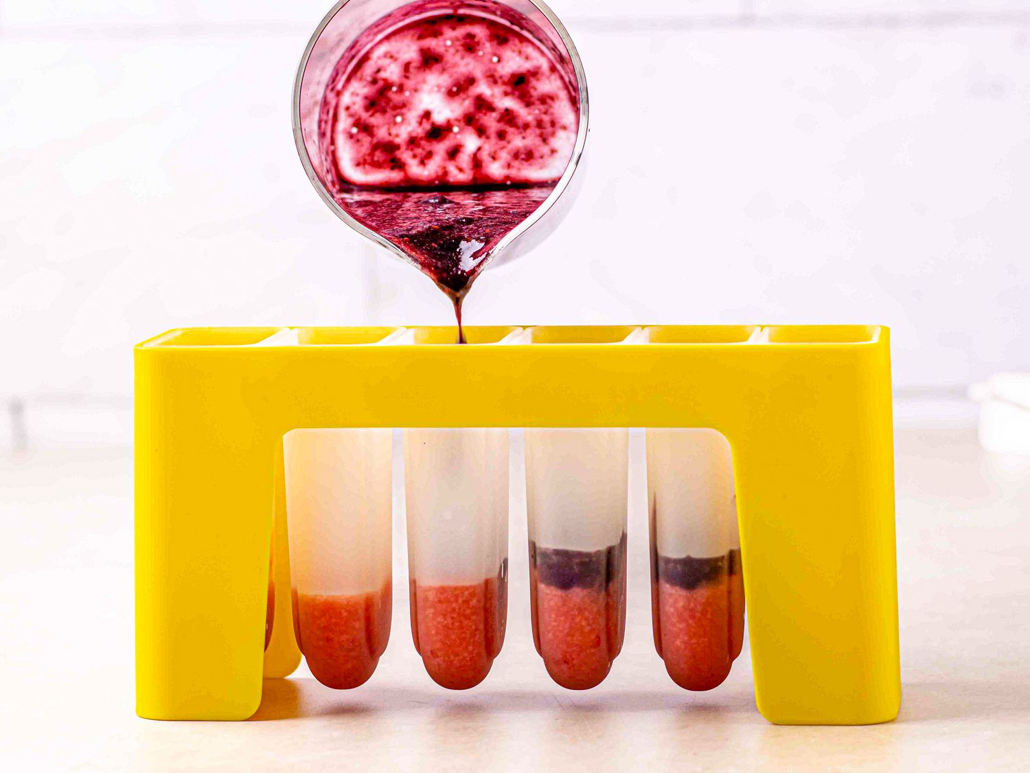 Side view of filling molds with kiwi filling