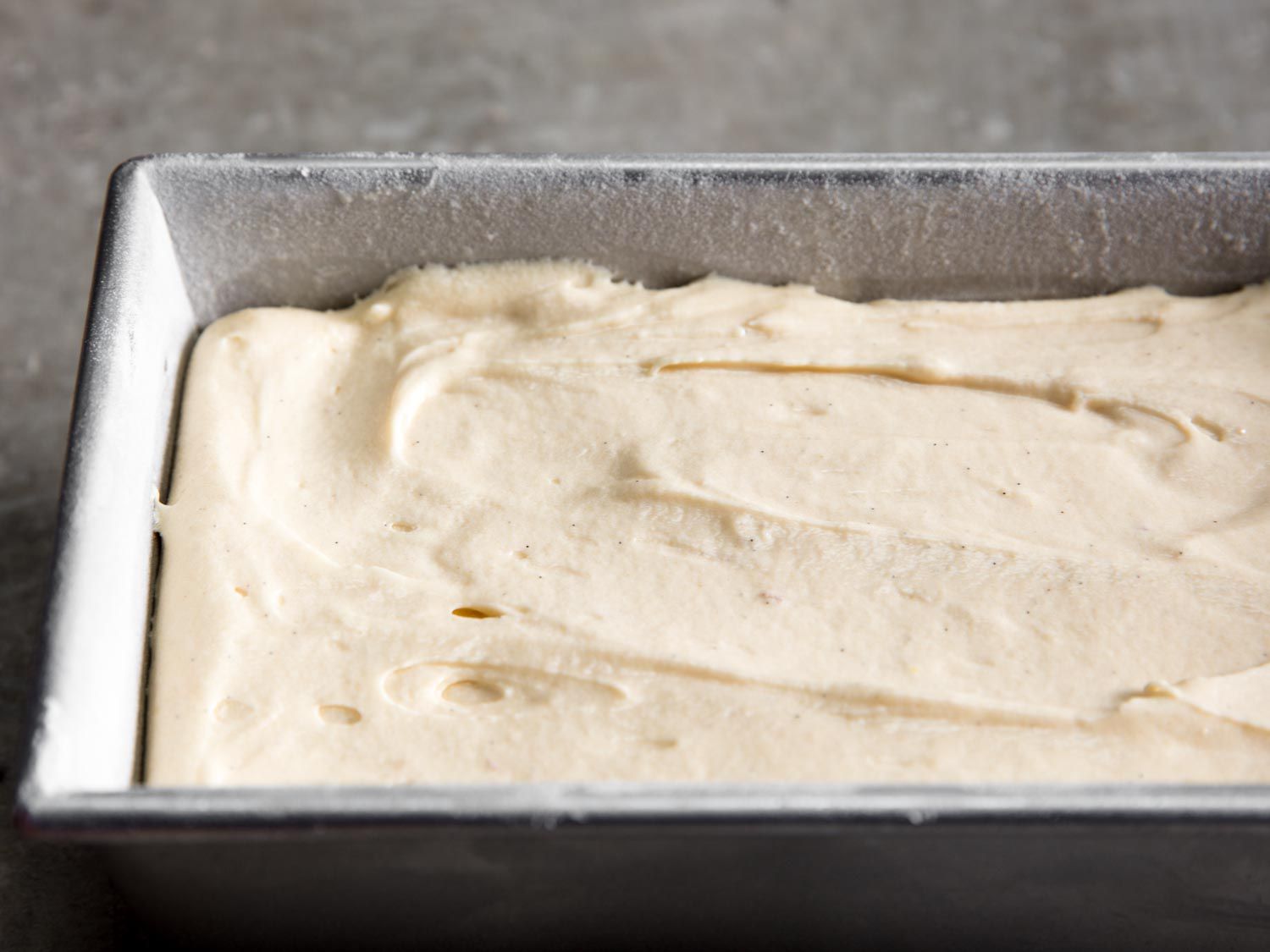 Unbaked cake batter in a loaf pan.