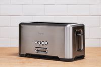 Breville BTA720XL A Bit More 2 Slice Toaster on wooden counter