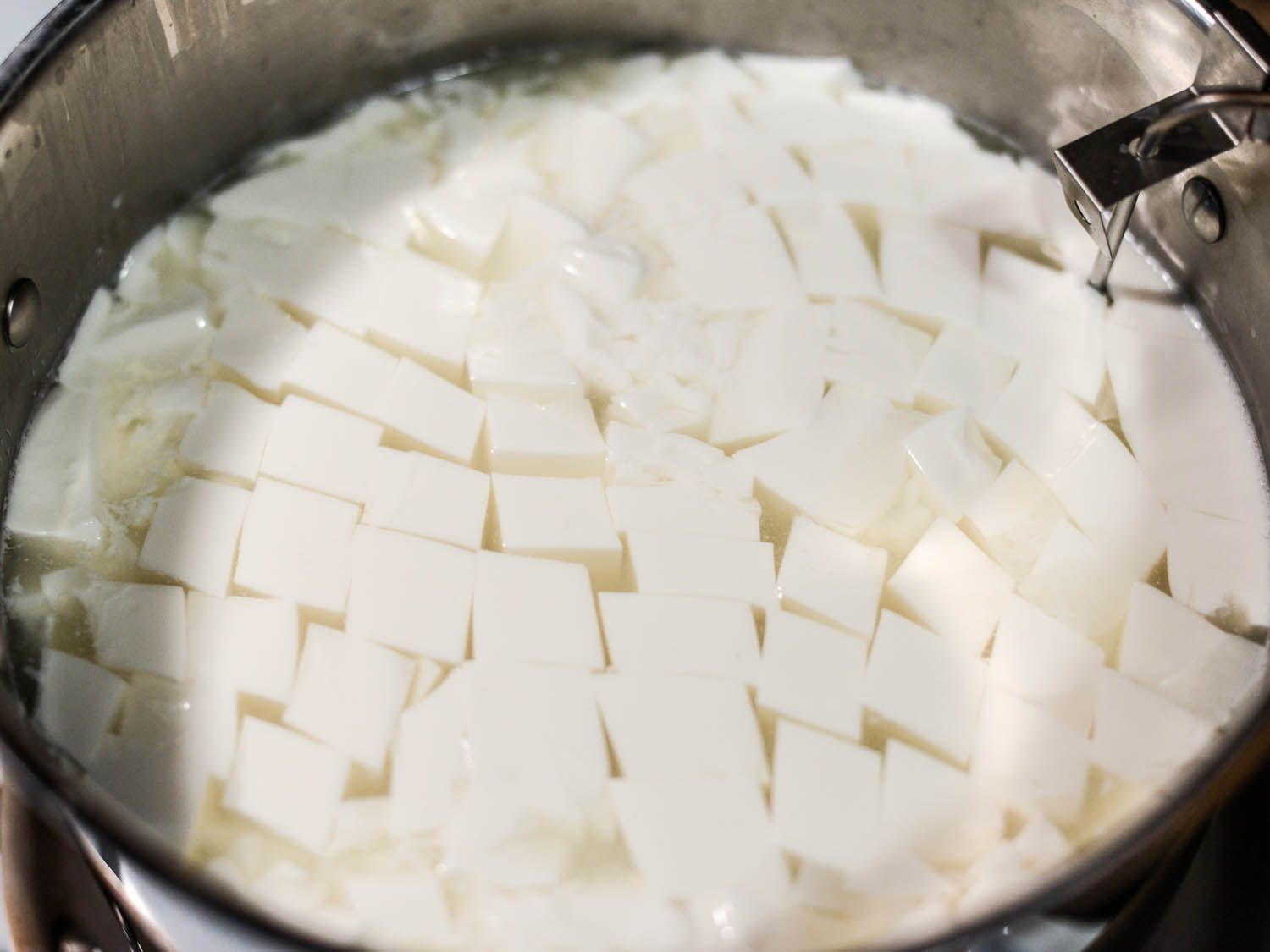 A pot of fresh-cut cheese curds.