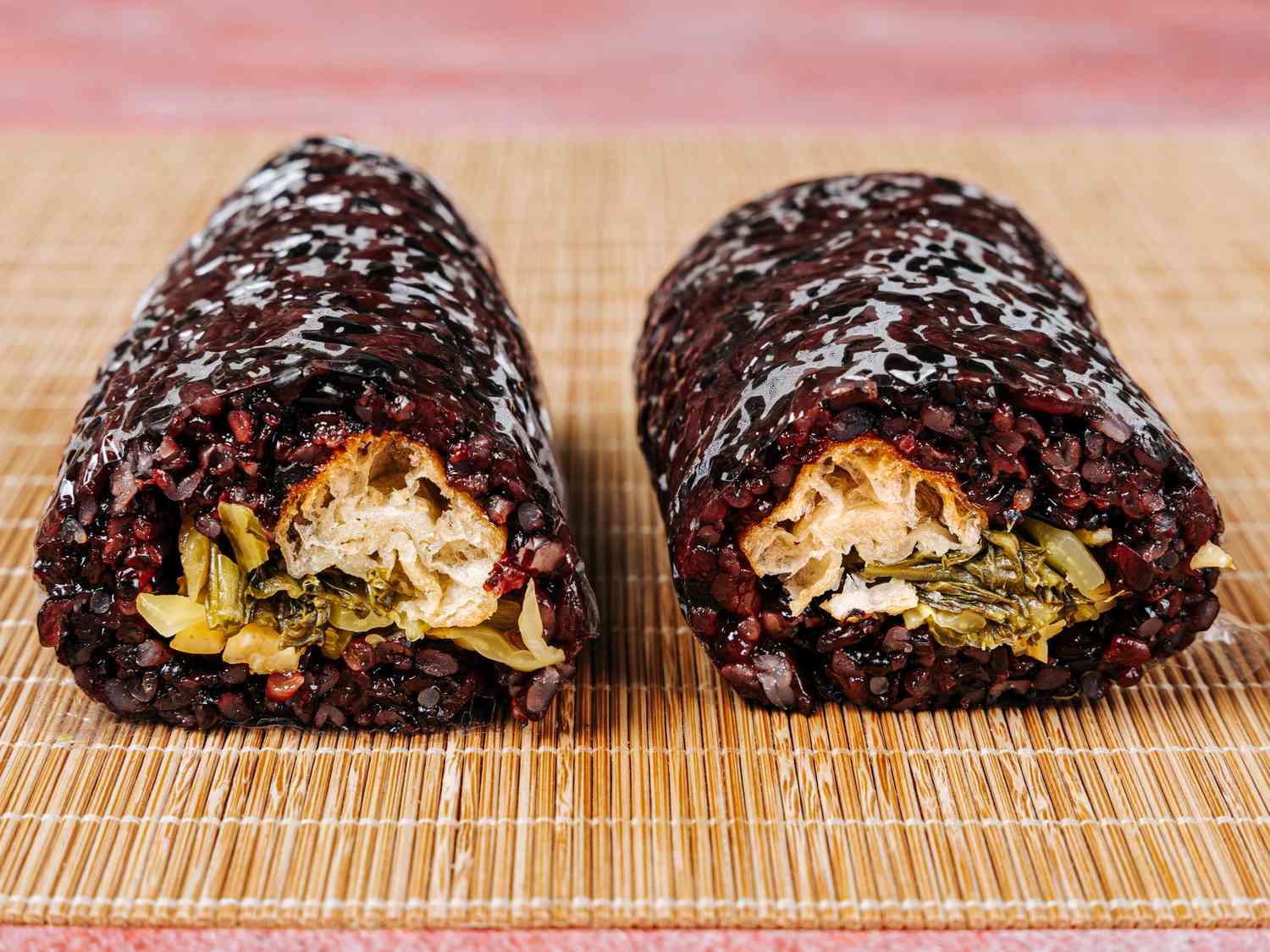 2 Fan Taun rolls side by side on a bamboo mat